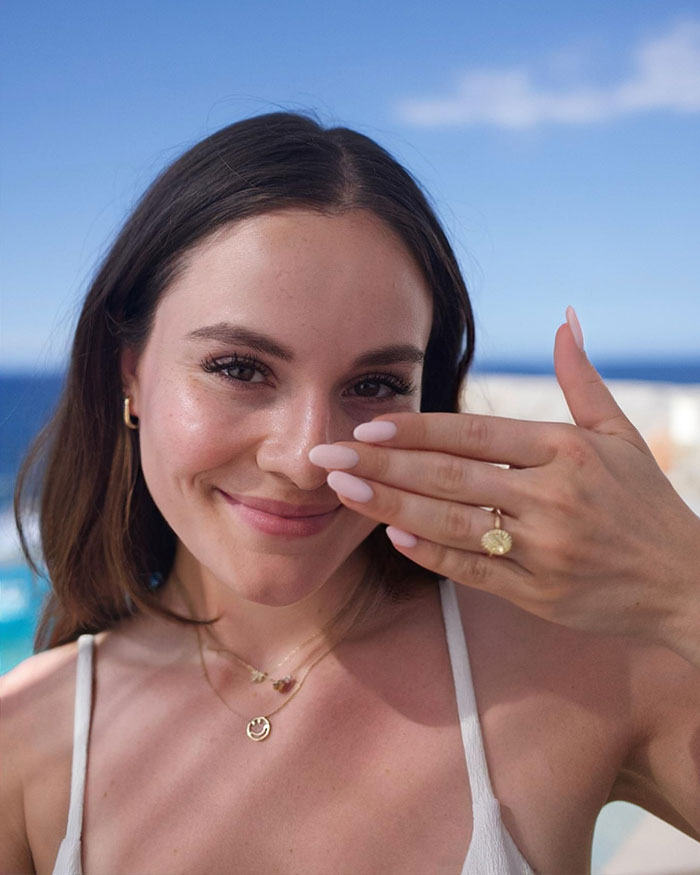 Gordon Ramsay&rsquo;s daughter smiling in bikini, showing ring during sunny Miami trip before wedding to Olympic swimmer.