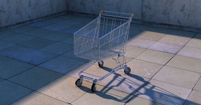 Empty shopping cart casting a shadow on pavement, symbolizing local dangers as a normal part of life for people.
