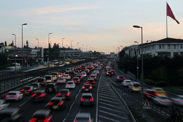 Heavy traffic congestion on a busy road at dusk illustrating local dangers in everyday life.