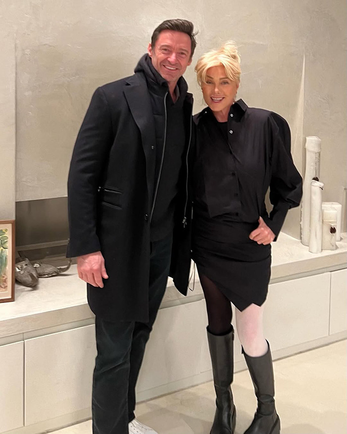 Hugh Jackman and a woman posing indoors, dressed in black, relating to Hugh Jackman setback amid divorce news.