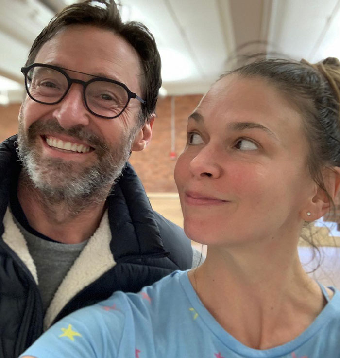 Hugh Jackman smiling with Sutton Foster indoors, highlighting their 17-year history amid divorce news. Hugh Jackman smiling with Sutton Foster indoors, highlighting their 17-year history amid divorce news.