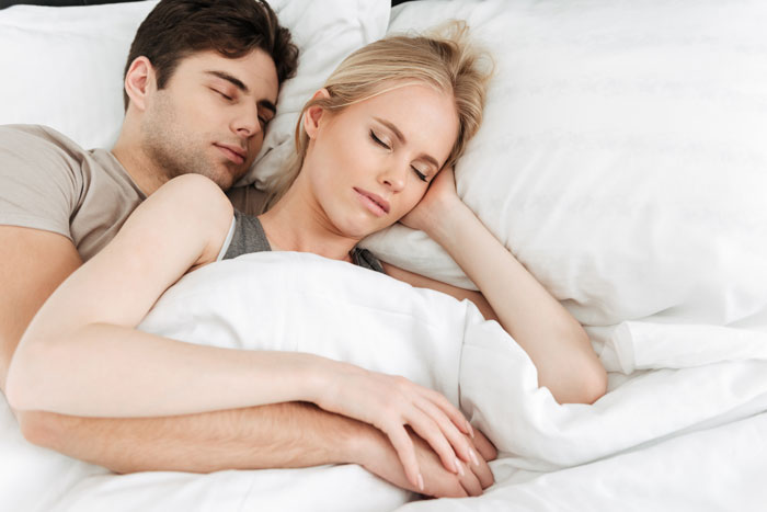 Husband enjoys lazy mornings in bed while wife sacrifices sleep, highlighting one-sided effort in their Sunday routine.