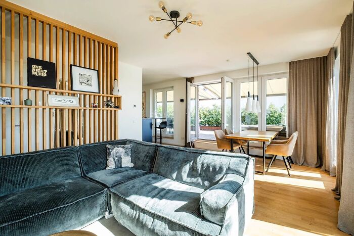 Modern apartment interior with spacious living and dining areas, showcasing what 1 million dollars buys worldwide.