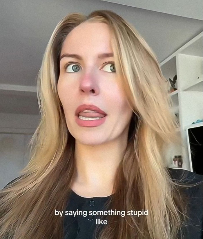 Woman reacting emotionally in a home setting, relating to a story about a pushy influencer rejected by Taylor Swift.