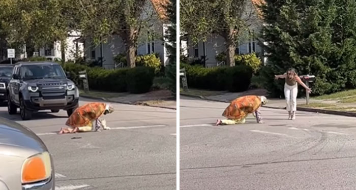 Influencer dressed as a turtle crawling on the street while a woman approaches, showcasing unhinged influencer behavior.