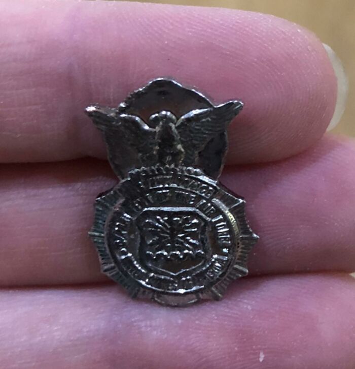 Small vintage police badge found among unexpected things hidden in walls and other secret places in homes.