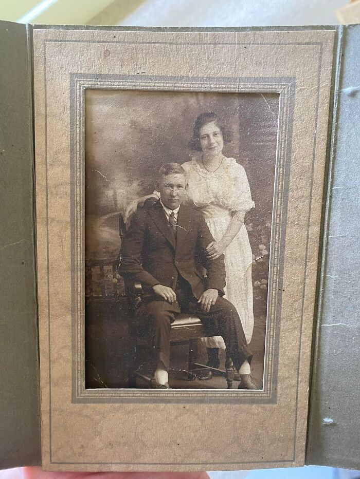 Vintage black and white photo of a couple found hidden in a wall as an unexpected thing in people’s homes.