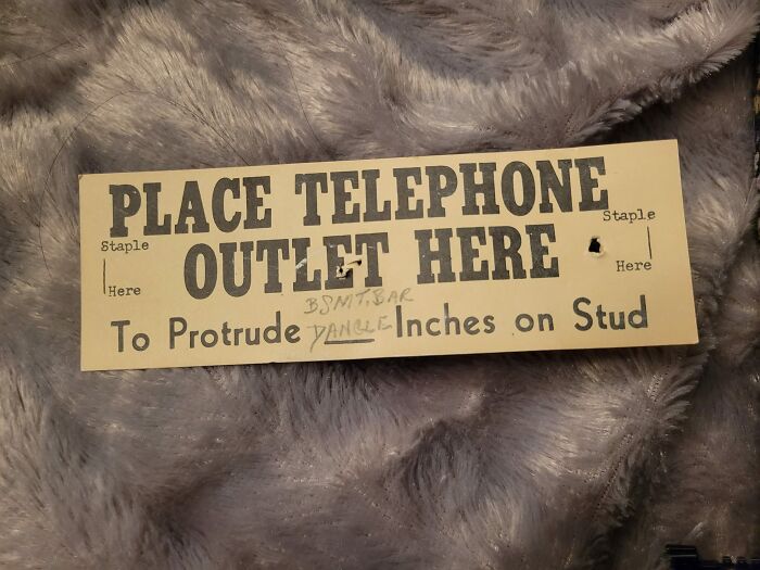 Vintage label showing instructions for placing a telephone outlet, an unexpected thing found in walls of homes.