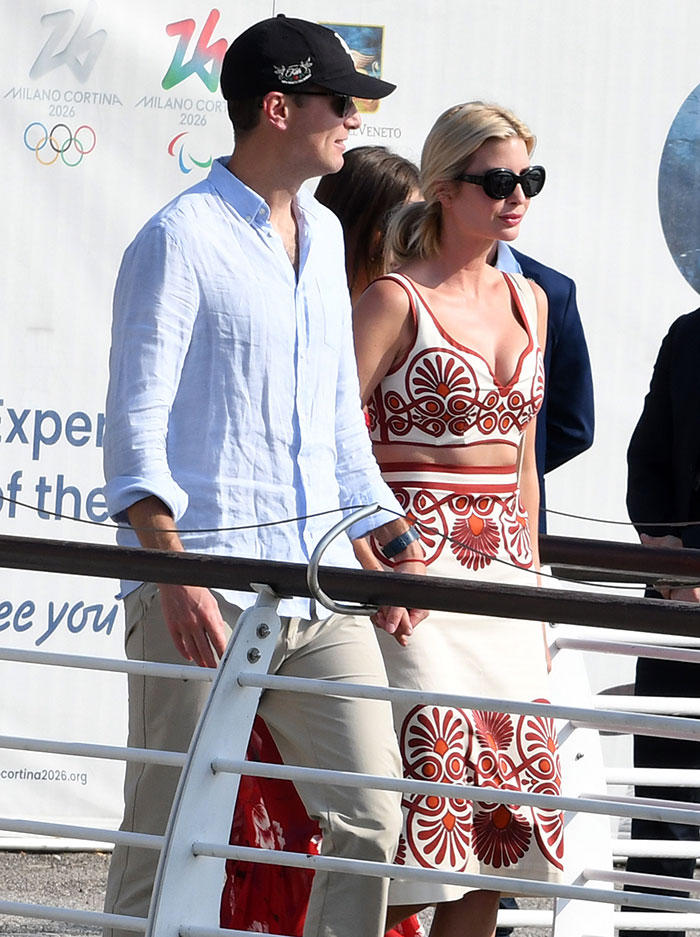 Couple dressed in stylish, bold outfits at a celebrity event during Jeff Bezos and Lauren Sánchez's wedding welcome party in Venice.