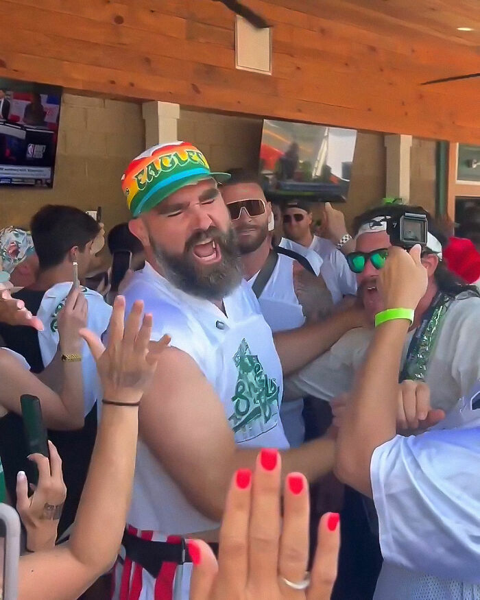 Jason Kelce's bulge highlighted as he enjoys a lively charity event surrounded by cheering crowd in casual attire. Jason Kelce's bulge highlighted as he enjoys a lively charity event surrounded by cheering crowd in casual attire.