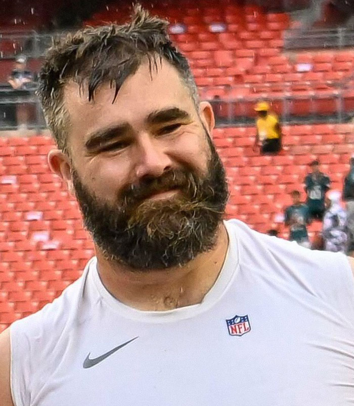 Jason Kelce smiling on field wearing NFL sleeveless shirt after charity event featuring bulge going viral. Jason Kelce smiling on field wearing NFL sleeveless shirt after charity event featuring bulge going viral.