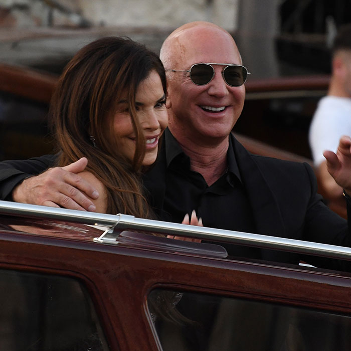 Jeff Bezos and Lauren S&aacute;nchez sharing a moment at a pajama-themed afterparty with racy revealing looks.