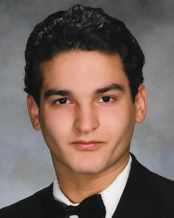Young man wearing a black tuxedo with a bow tie, representing a face transplant recipient from a 47-year-old donor. Young man wearing a black tuxedo with a bow tie, representing a face transplant recipient from a 47-year-old donor.