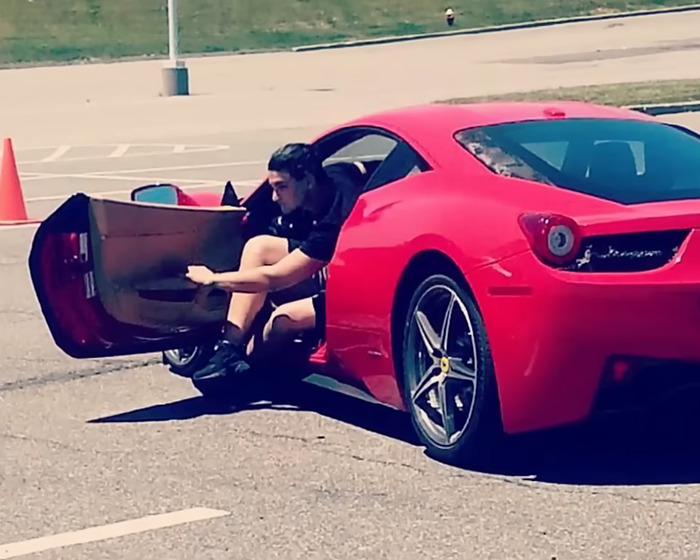 Man sitting in a red sports car with door open, representing a man who got a new face transplanted. Man sitting in a red sports car with door open, representing a man who got a new face transplanted.