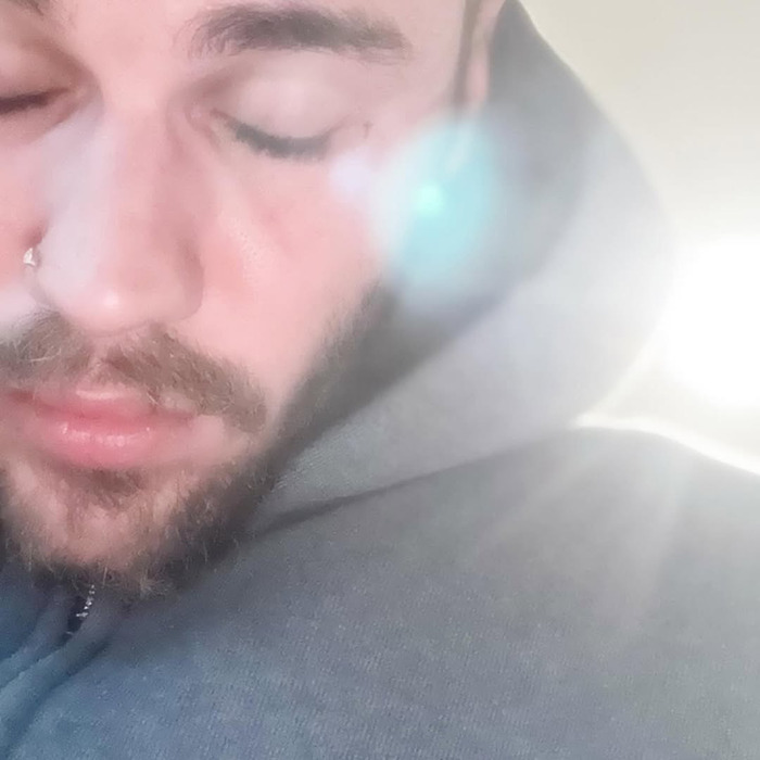 Close-up of Justin Bieber with eyes closed and soft sunlight, reflecting a sad confession after an aggressive meltdown. Close-up of Justin Bieber with eyes closed and soft sunlight, reflecting a sad confession after an aggressive meltdown.