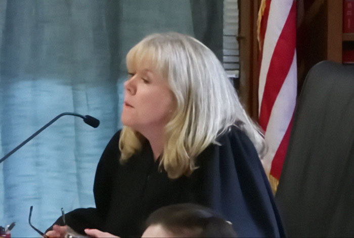 Woman in a courtroom setting during a trial related to Karen Read acquitted in slaying of cop boyfriend case.