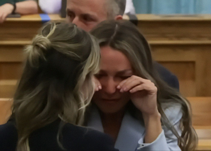 Karen Read emotional in courtroom after acquittal in trial for slaying cop boyfriend, sparking public outrage and mass fury.