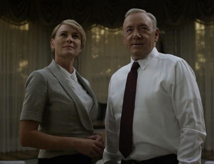 Kevin Spacey in formal attire alongside a woman, amid rumors of plastic surgery after award event appearance.