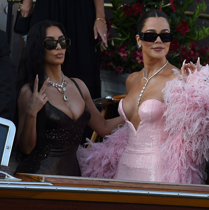 Two women wearing sunglasses and glamorous dresses attend Jeff Bezos and Lauren S&aacute;nchez wedding guests event.