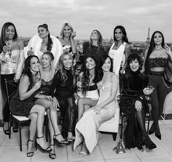 Group of women dressed elegantly celebrating with drinks amid mass fury after details of Jeff Bezos' lavish wedding released. Group of women dressed elegantly celebrating with drinks amid mass fury after details of Jeff Bezos' lavish wedding released.