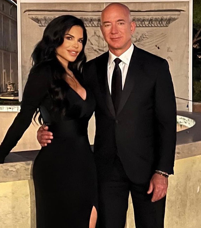 Jeff Bezos and Lauren Sanchez posing together in formal attire amid mass fury over lavish wedding details. Jeff Bezos and Lauren Sanchez posing together in formal attire amid mass fury over lavish wedding details.