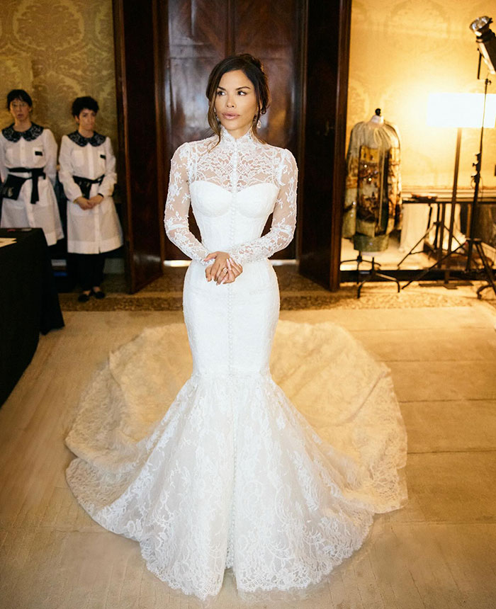 Woman in a white lace wedding gown, related to Kim Kardashian claims about guests crying at Jeff Bezos wedding ceremony.