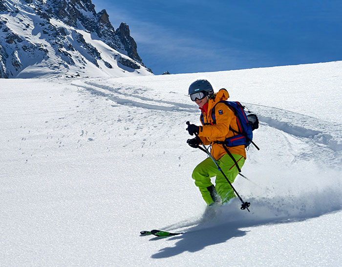 Skier in bright clothing descending snowy slope with mountains in the background, illustrating lawyers not winning their case.