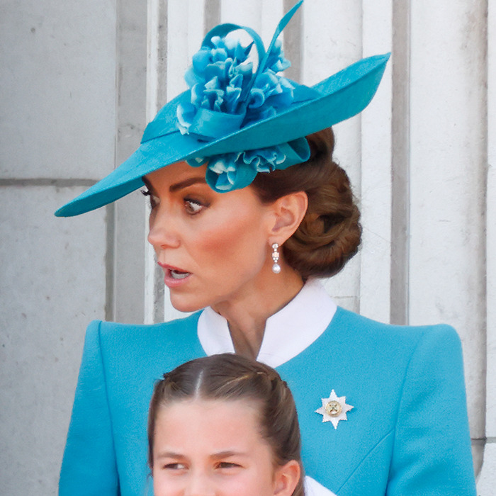 Kate Middleton in a blue hat giving a strict order to Prince Louis during Trooping The Colour ceremony. Kate Middleton in a blue hat giving a strict order to Prince Louis during Trooping The Colour ceremony.