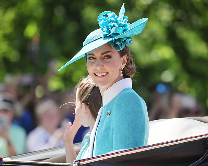Kate Middleton wearing turquoise hat and coat at Trooping The Colour event during royal procession. Kate Middleton wearing turquoise hat and coat at Trooping The Colour event during royal procession.