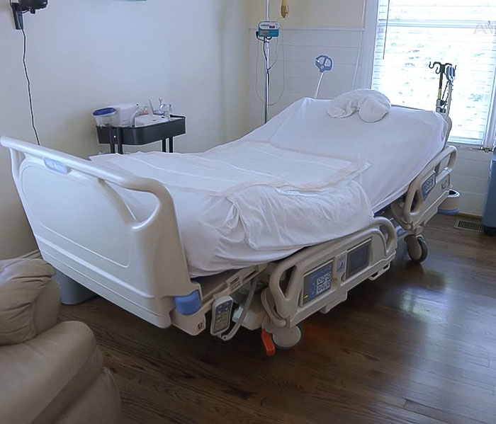 Hospital bed in a patient room, representing a man with neck pain and locked-in syndrome after chiropractor visit.