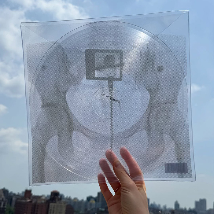 Lorde vinyl release held up against sky revealing an X-rated image inside stunning fans with its graphic design. Lorde vinyl release held up against sky revealing an X-rated image inside stunning fans with its graphic design.
