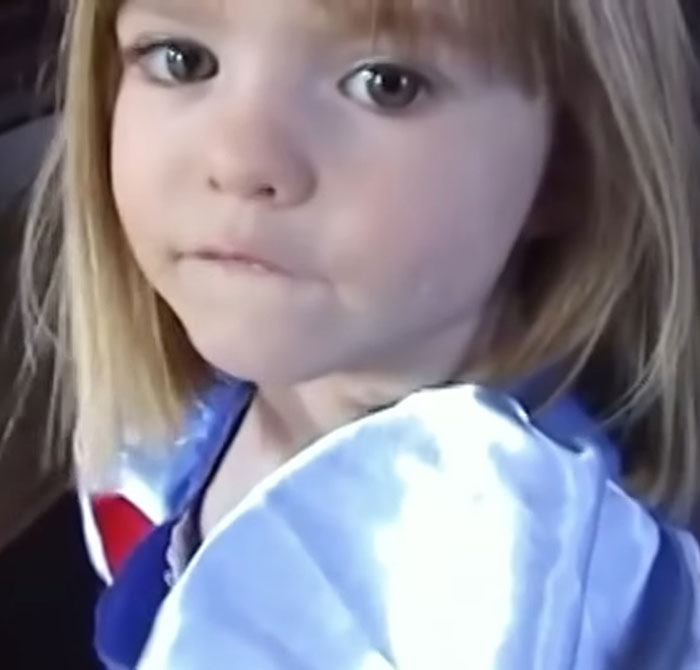 Young girl with blonde hair looking serious, related to disturbing new theory in Madeleine McCann disappearance case.