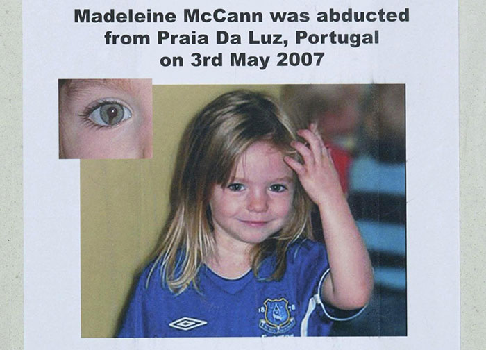 Photo of young Madeleine McCann in a blue shirt with text about detectives discovering buried weapons during a search.