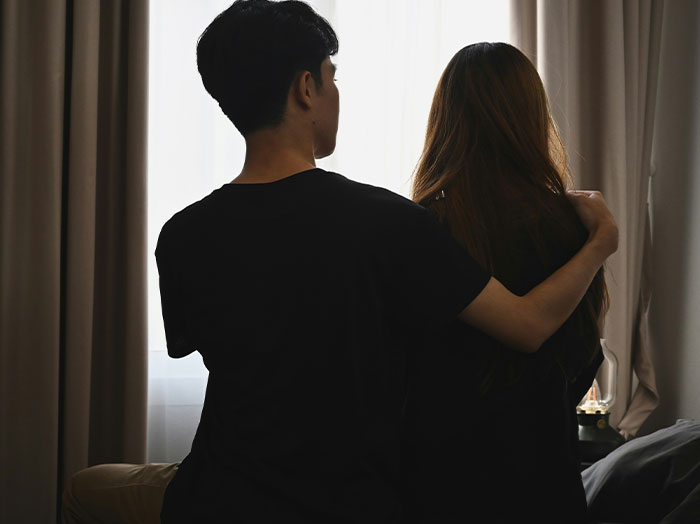 Couple sharing a tender moment indoors, highlighting romantic connection where men made women feel they stand out.