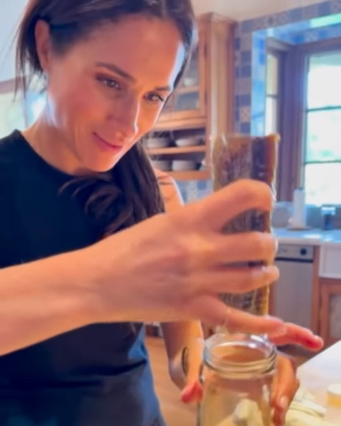 Meghan Markle preparing food in a kitchen, highlighting her brand's connection to Williams Sonoma products. Meghan Markle preparing food in a kitchen, highlighting her brand's connection to Williams Sonoma products.