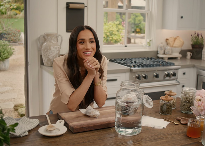 Meghan Markle sitting in a modern kitchen, discussed after fans discover her brand’s products from Williams Sonoma. Meghan Markle sitting in a modern kitchen, discussed after fans discover her brand’s products from Williams Sonoma.