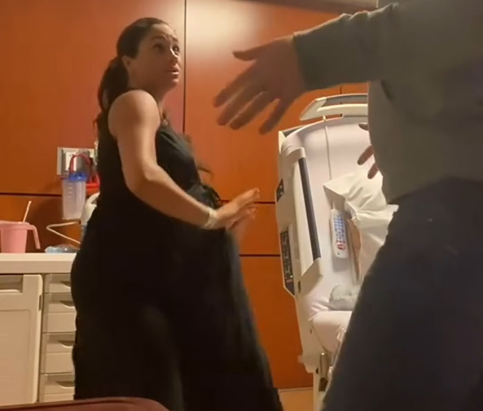 Meghan Markle in a hospital room with a concerned expression, captured during a controversial interview moment.