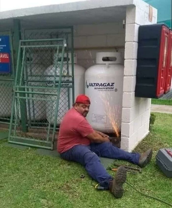 Man dangerously grinding metal near gas tanks, illustrating reckless behavior and why women live longer according to the image.