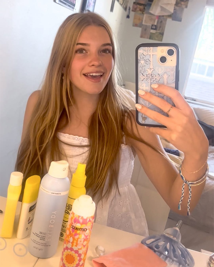 Beloved child star from Good Luck Charlie taking a selfie, showcasing her grown-up look at age 16 in a bright room.