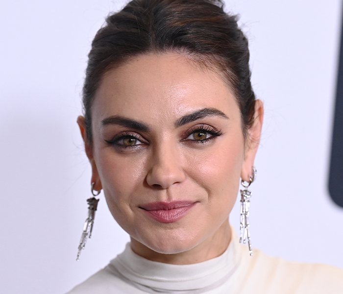 Close-up of a woman with flawless skin and unique features, highlighting bizarre celebrity body anomalies that intrigued fans.