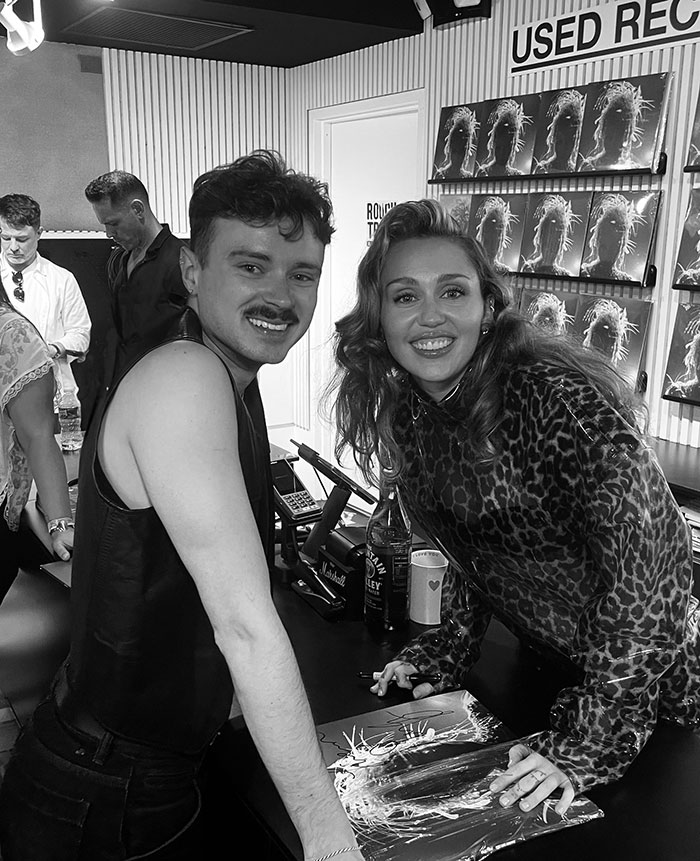 Miley Cyrus at a record signing event, wearing leopard print, related to viral comments on ex-husband Liam Hemsworth. Miley Cyrus at a record signing event, wearing leopard print, related to viral comments on ex-husband Liam Hemsworth.