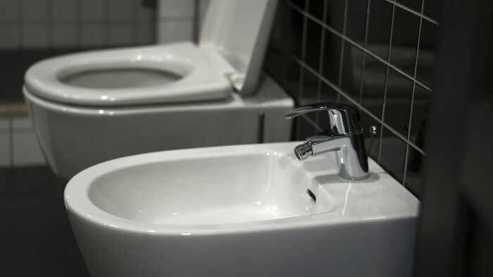 Modern white bidet and toilet in a bathroom showcasing everyday items under 300 dollars that improved people’s lives.