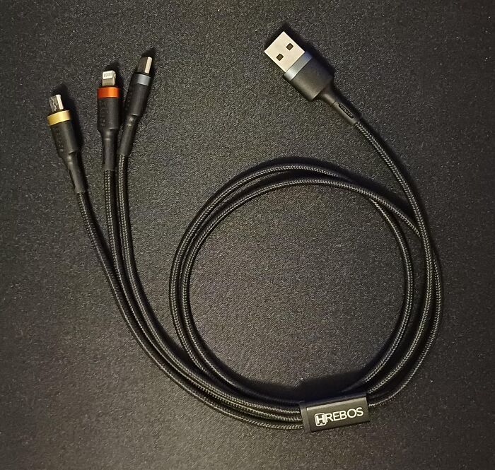 Multi-device charging cable with USB connector and three different charging tips, an affordable everyday item under $300.