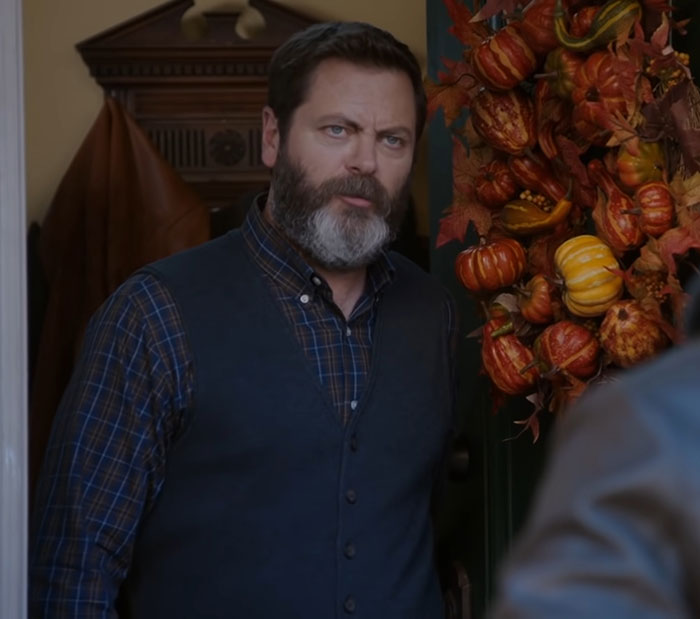 Nick Offerman standing at a doorway with autumn wreath, known for his praised brutal clapback against homophobe. Nick Offerman standing at a doorway with autumn wreath, known for his praised brutal clapback against homophobe.