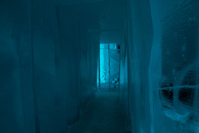 Narrow glowing blue icy corridor representing mysterious and eerie atmosphere linked to theories about the afterlife.