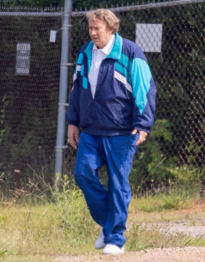Nicolas Cage in a fat suit on set of a new biopic about legendary football coach John Madden wearing a tracksuit outdoors. Nicolas Cage in a fat suit on set of a new biopic about legendary football coach John Madden wearing a tracksuit outdoors.