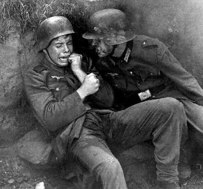 Two soldiers in helmets in a tense moment, symbolizing more cosmic chaos and Nostradamus predictions for 2025.