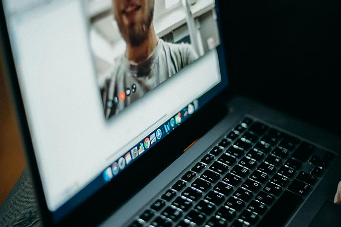 Healthcare worker video chatting on laptop, sharing moments that changed healthcare workers forever.