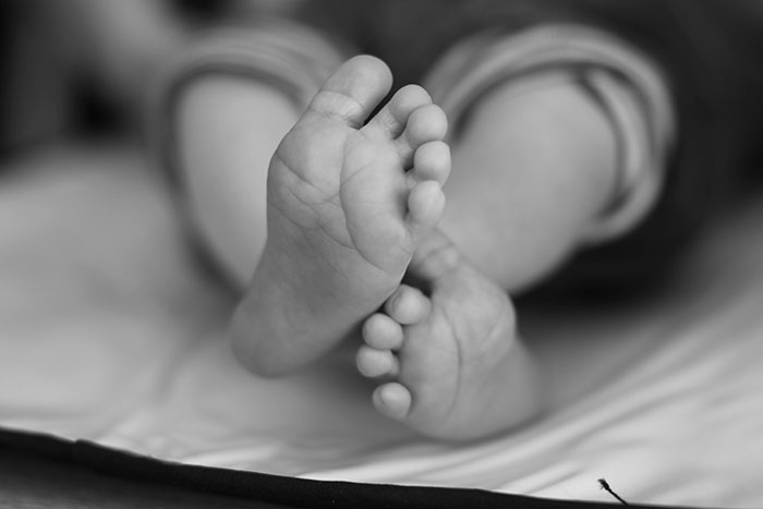 Close-up of baby’s feet on a blanket, symbolizing emotional moments that changed healthcare workers forever.