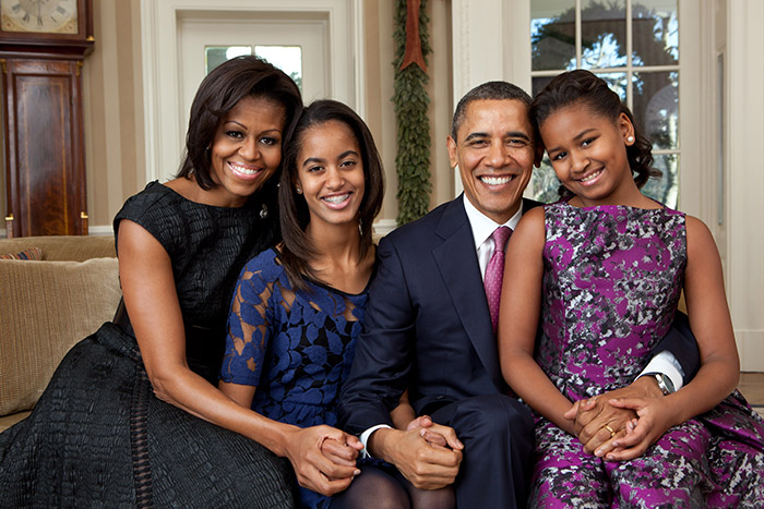 Michelle Obama with family in a formal setting addressing reactions to daughter Malia dropping last name. Michelle Obama with family in a formal setting addressing reactions to daughter Malia dropping last name.
